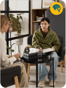 a person sitting one on one with a specialist in a partial hospitalization program