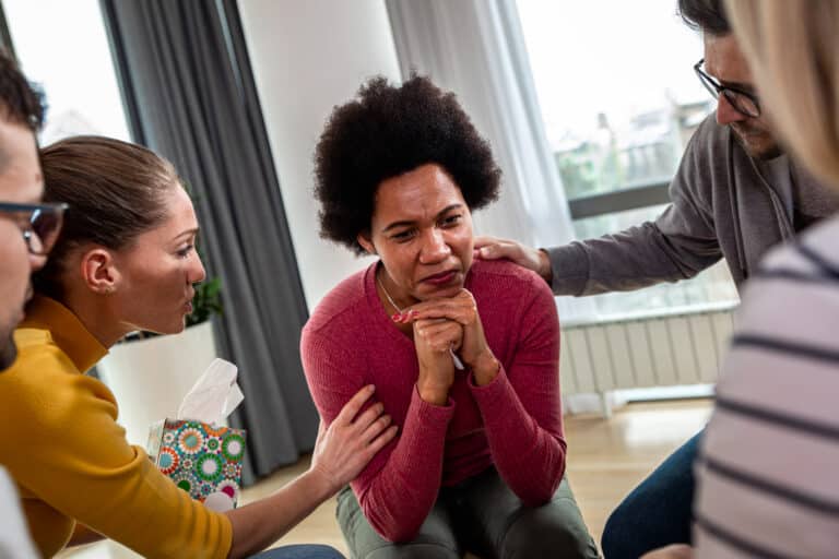 A diverse group in a group therapy session