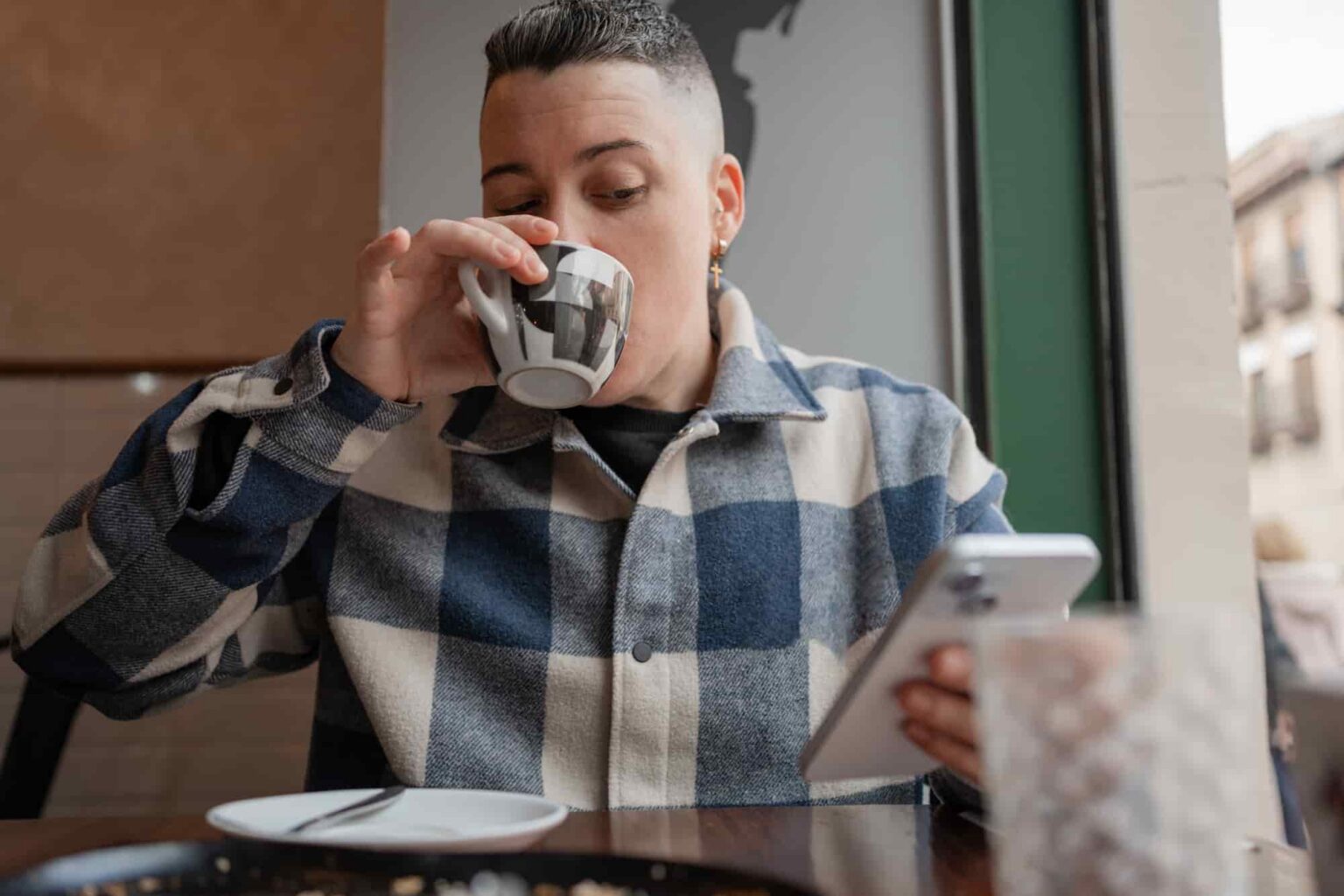 adult enjoys coffee break using cell phone 2026 09 22 07 31 13 utc 1 1