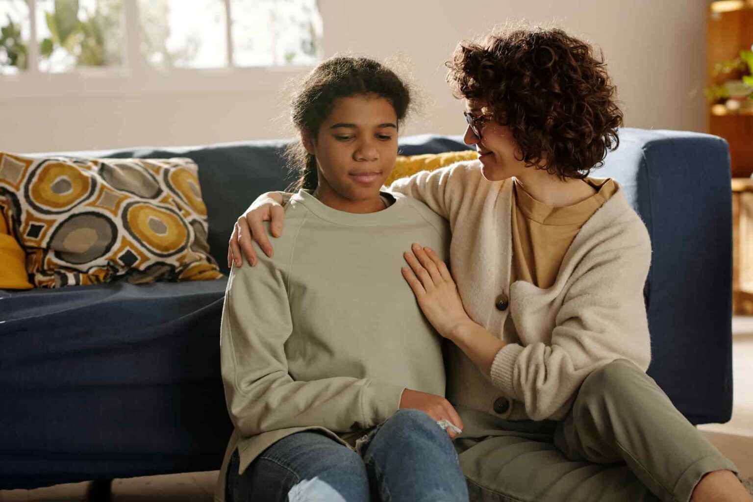 caring woman comforting a teen at home 2026 03 25 02 45 19 utc 1